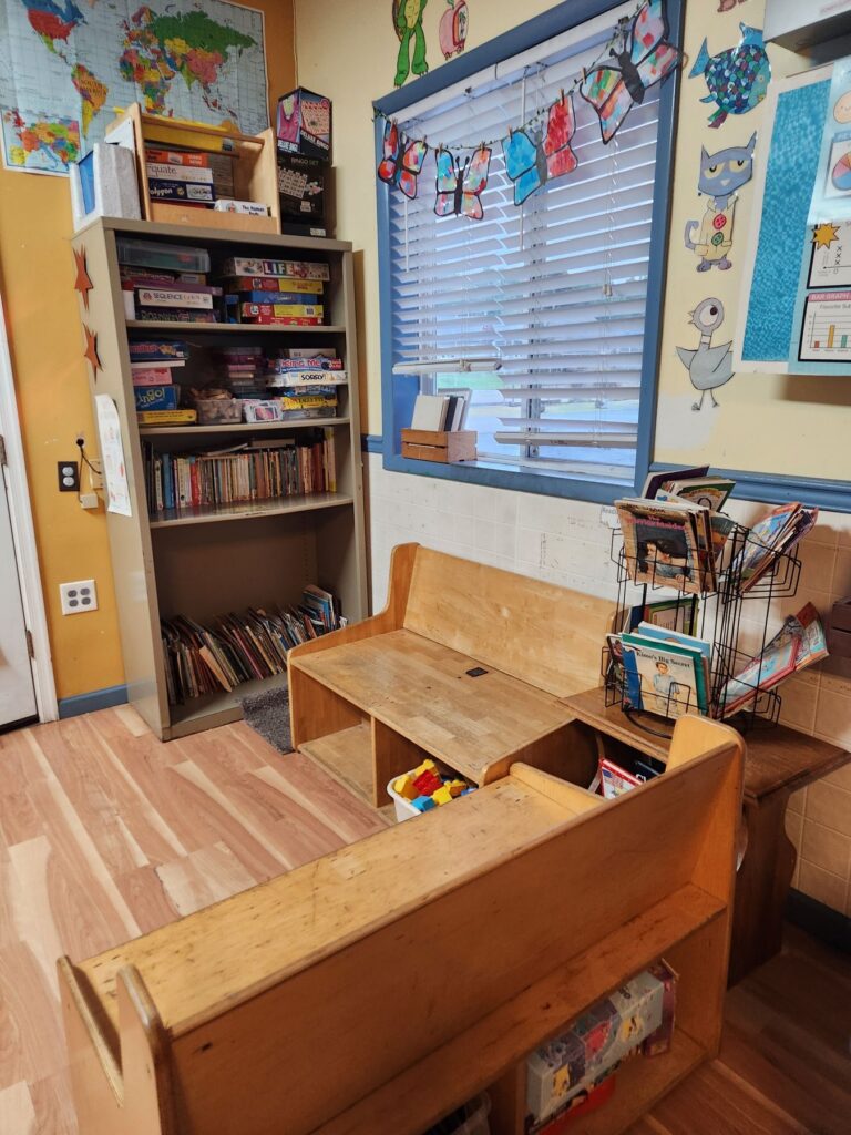 School-age classroom reading nook and bookshelves
