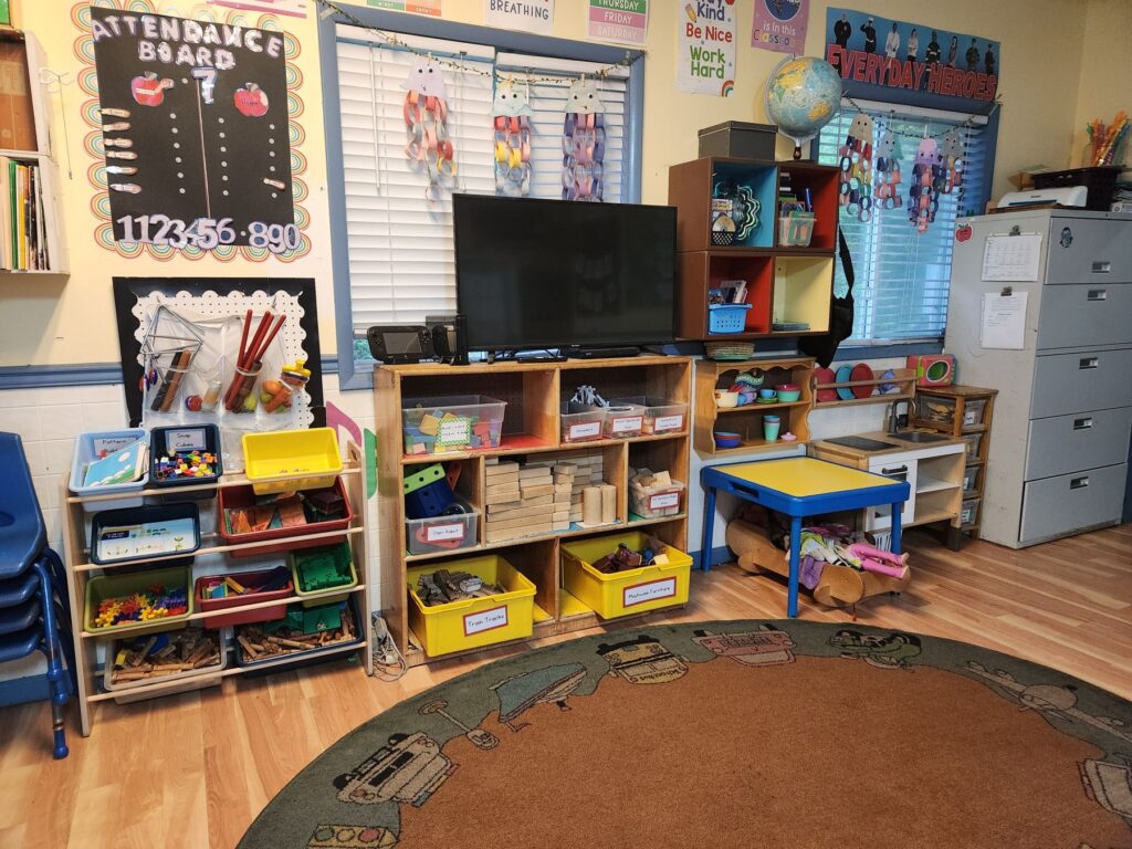 School-age classroom with learning centers and a circle rug