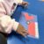 Child assembling a paper firetruck